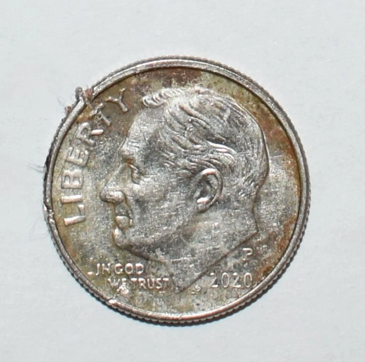 2020 Roosevelt dime die cud error showing raised unstruck blob at rim where die broke